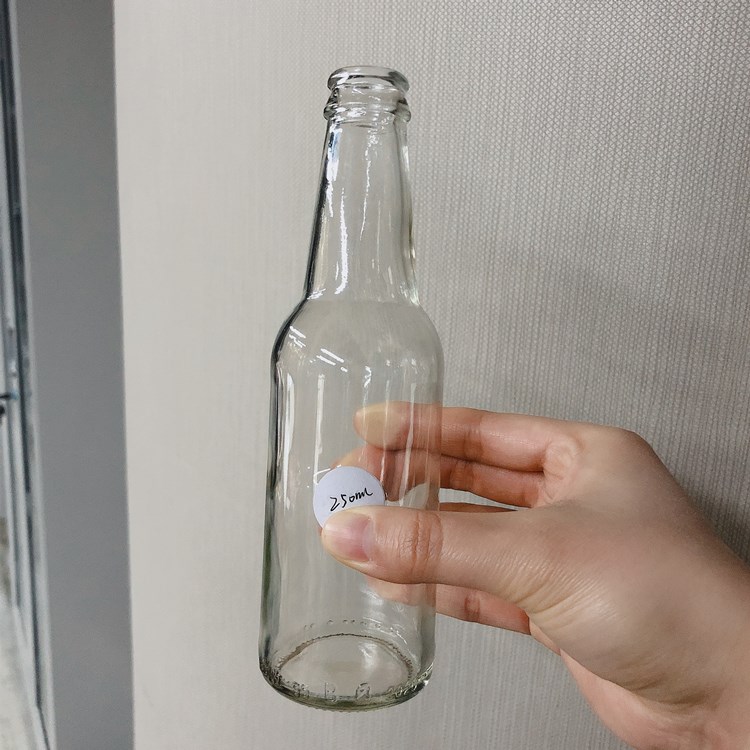 wholesale 250ml 330ml 500ml clear glass drinking bottle for beer with crown cap