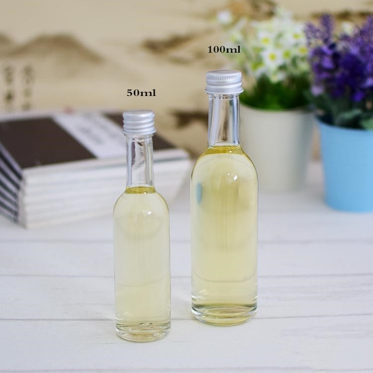 empty 50ml 100ml mini round glass liquor bottle with screw cap