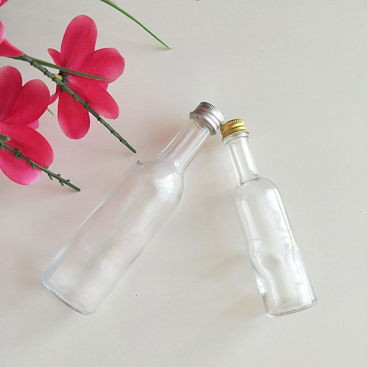 empty 50ml 100ml mini round glass liquor bottle with screw cap