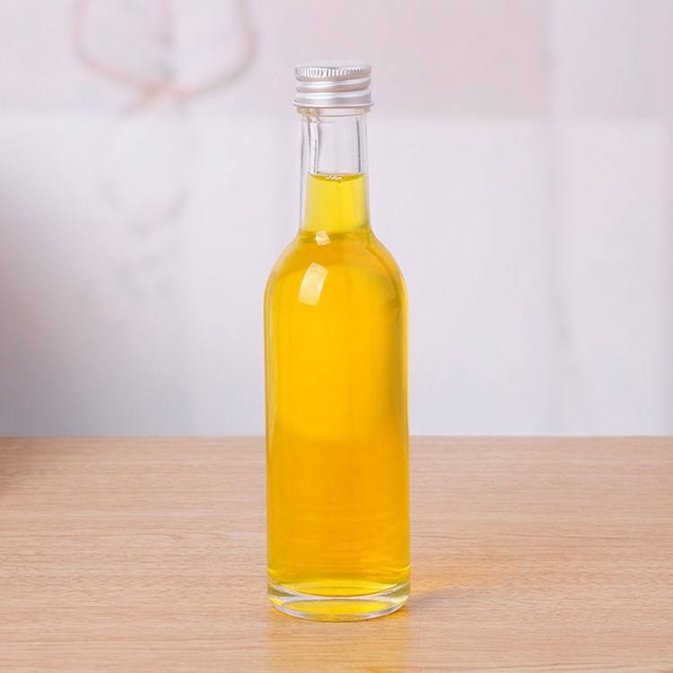 empty 50ml 100ml mini round glass liquor bottle with screw cap