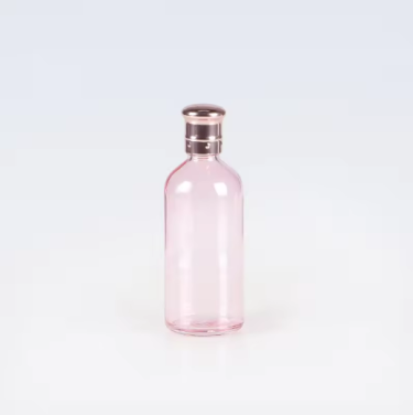 Customized color 30ml 50ml 100ml clear pink essential oil glass bottle with rose golden cap