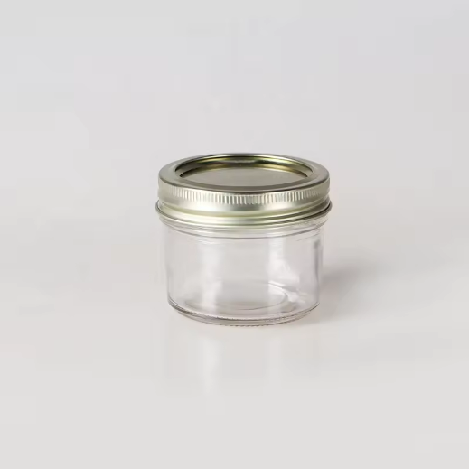 Transparent round 100ml food grade small honey packaging glass jam jars with lids