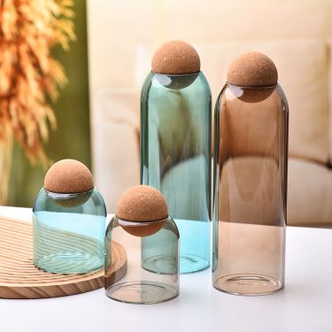Luxury Customized Colored Amber Blue Short and Tall Cylinder Borosilicate Glass Food Sealed Storage Jar with Cork Ball