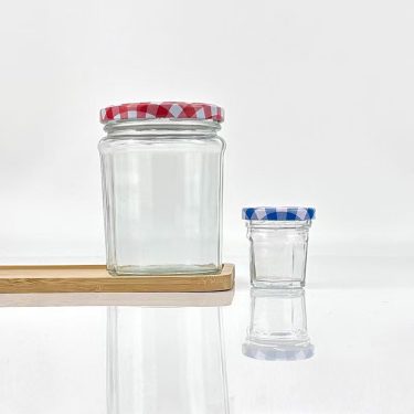 Wholesale 50ml 100ml 150ml 200ml 250ml 380ml Clear 12 Angles Round Food Storage Glass Jars with Screw Lid for Jam Sauce Honey
