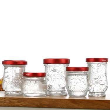 Wholesale 50ml 75ml 100ml Clear Empty Bottom Vertical Stripe Relief Bird Nest Honey Jam Caviar Packing Glass Jars With Lids