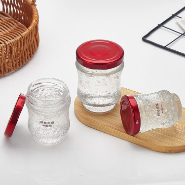 Wholesale 45ml 75ml 100ml Clear Empty Embossed Bird Nest Honey Jam Caviar Packing Glass Jars With Lids
