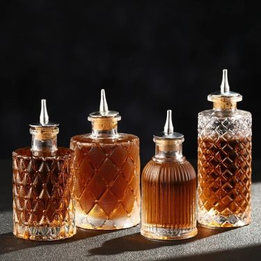 Luxury Transparent Embossed Wine Bottle Glass Bottle Whiskey Red Wine Packaging Empty Glass Oil Bottle with Oil Nozzle