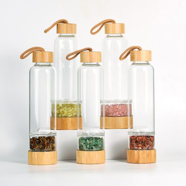 Manufacturers Supply 500ml Natural Crystal Gravel Energy Glass Water Bottle Glass Drinkware with Bamboo Lid and Handle Rope