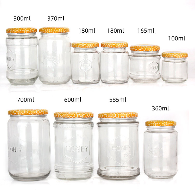 150ml 180ml 300ml 600ml 700ml Iraq Hot Sale Round Shape Bee Honey Glass Container Jar With Honeycomb Printed Lids