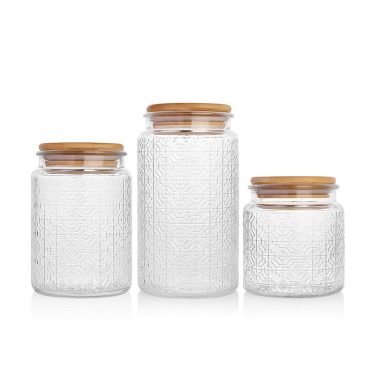 Wholesale embossed surface empty food grade glass storage jar with bamboo lid