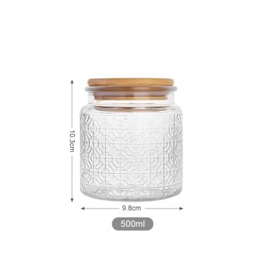 Wholesale embossed surface empty food grade glass storage jar with bamboo lid