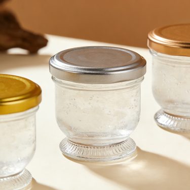 Wholesale lotus shape empty 60ml 85ml 130ml bird nest bottle glass jar with airtight lid