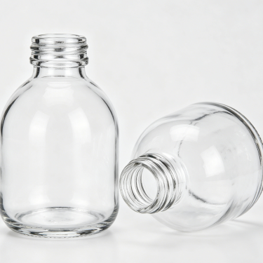 Classic Round Glass Beverage Bottle Clear Juice Milk Tea Coffee Packaging Container with Wide Mouth Reusable Design