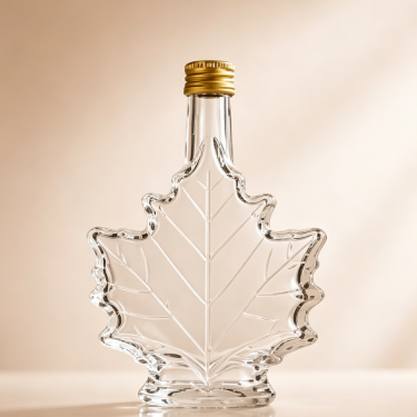 Custom Clear Maple Leaf Glass Wine Bottle Premium Liquor Spirit Whiskey Vodka Packaging Bottle with Screw Cap
